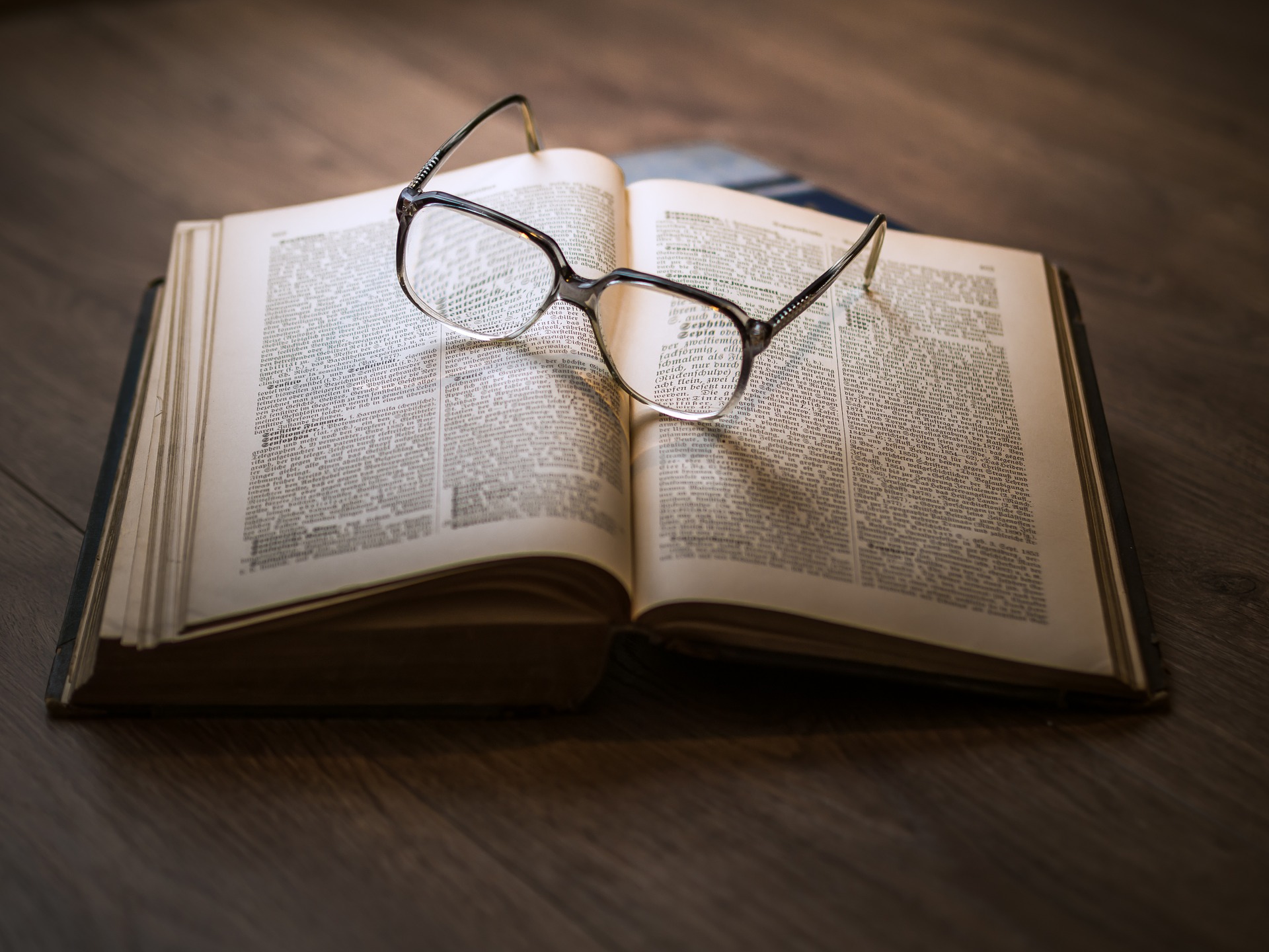 Decorative image of a book and pair of glasses