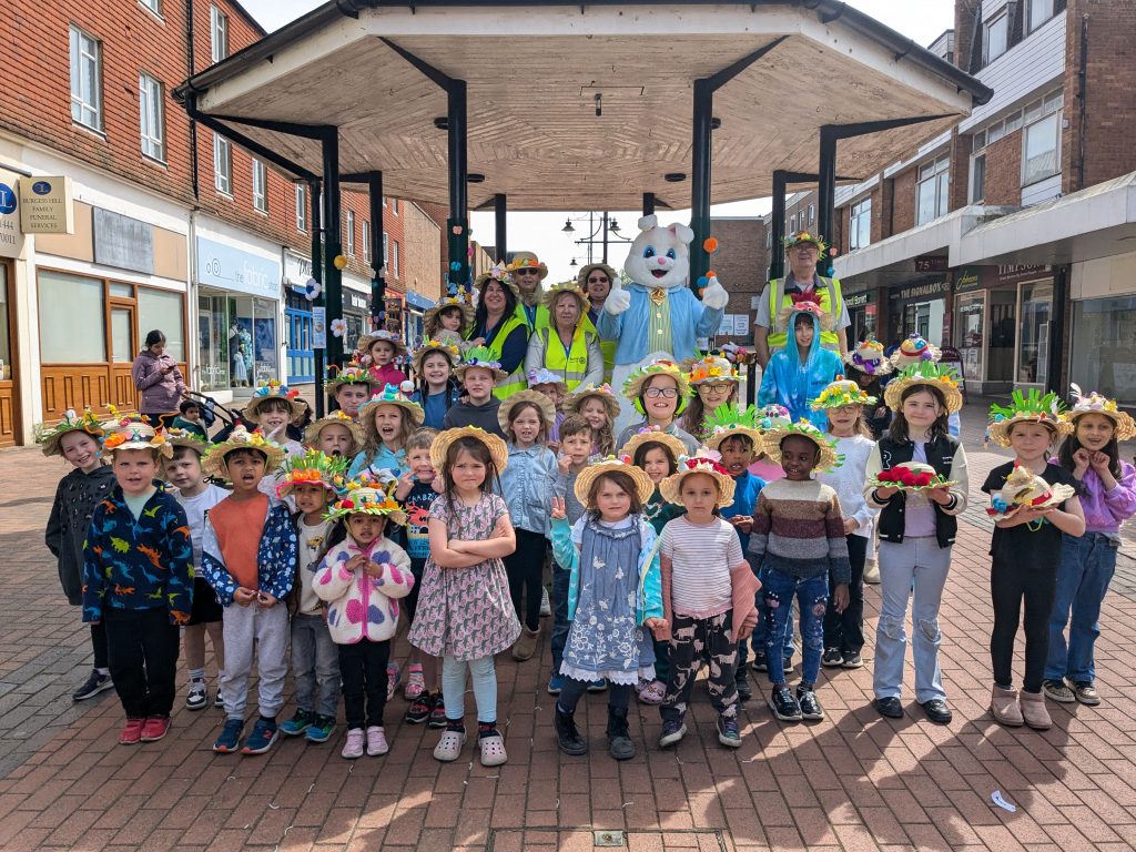 Photo of children in their finished Easter bonnets next to the bandstand on Church Walk